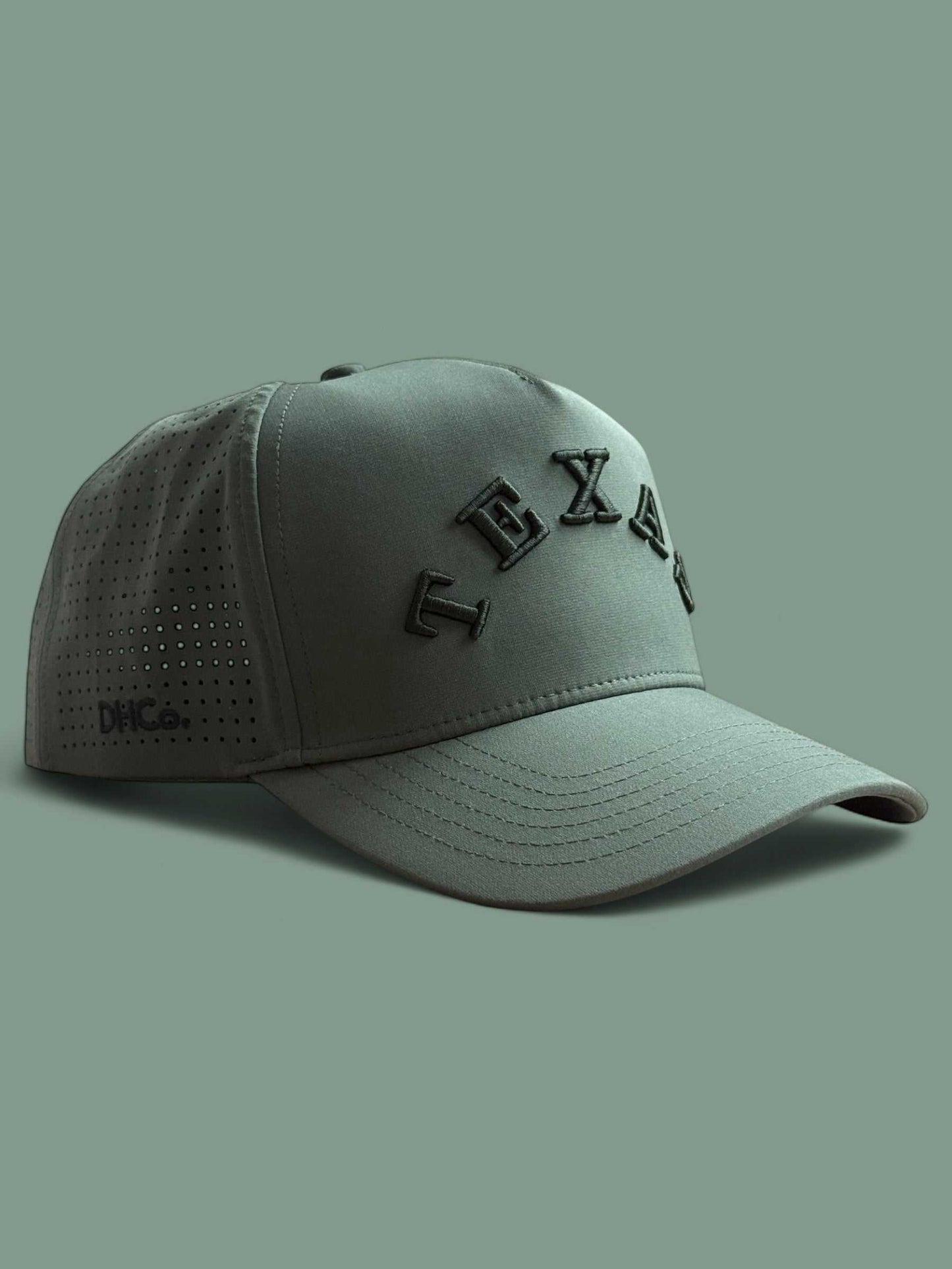The Texas Performance Snapback, olive green nylon cap with perforated panels and raised tonal lettering
