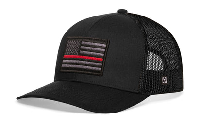 Thin Red Line Trucker Hat in black with mesh back, embroidered subdued American flag patch featuring a thin red line stripe on front panel.