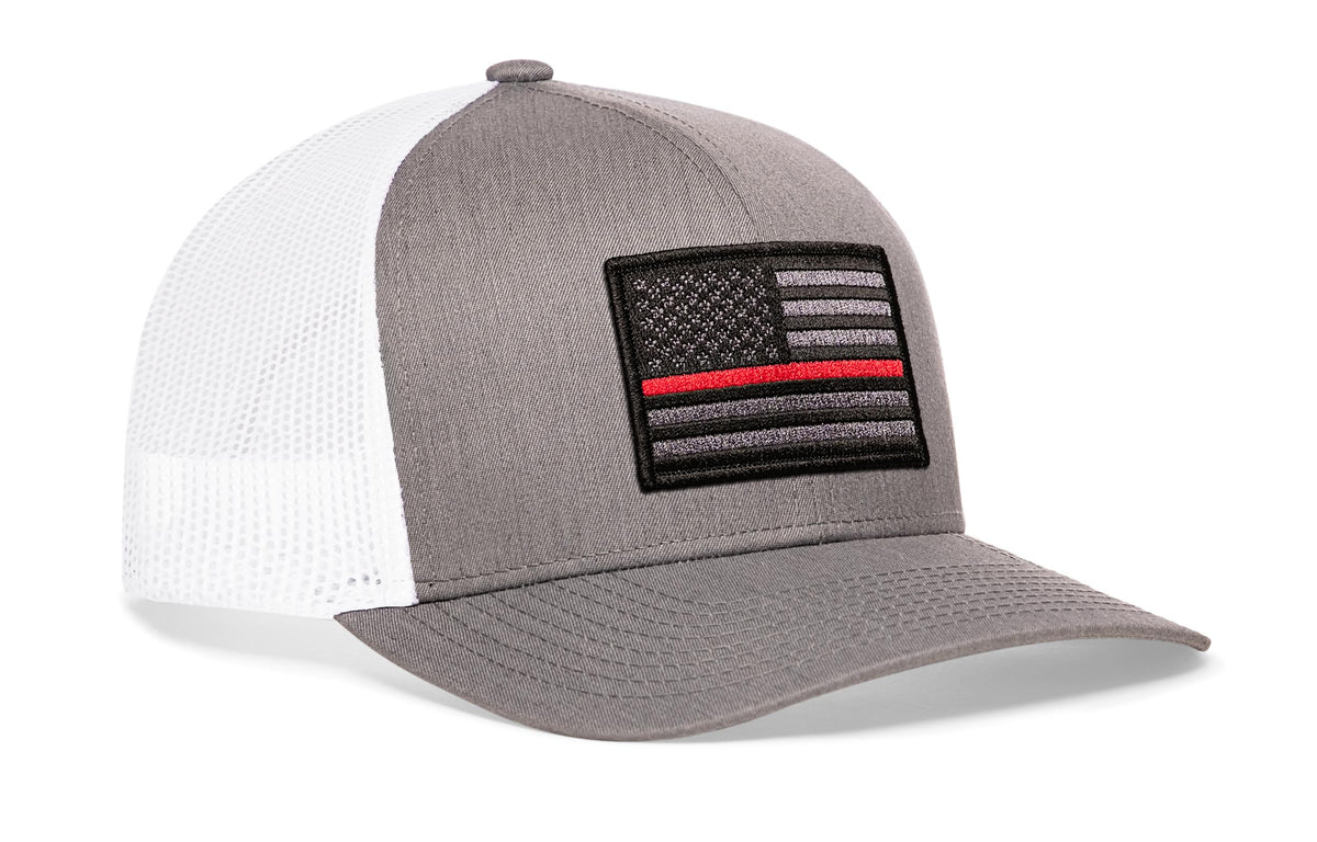 Thin Red Line Trucker Hat in gray and white mesh with an embroidered black and gray American flag patch featuring a red line stripe