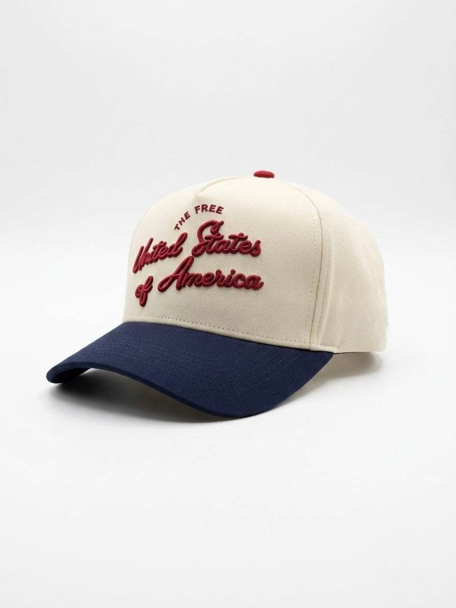 U.S.A Script Hat in beige cotton with navy curved brim and red embroidered United States of America lettering