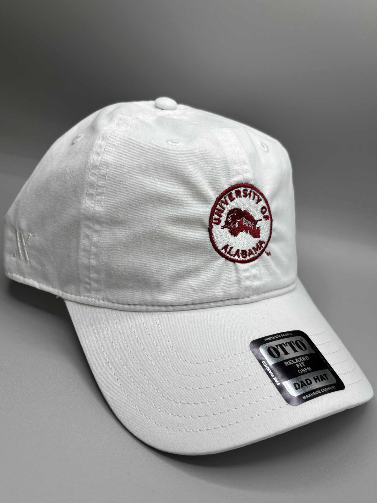 University of Alabama white cotton dad hat with embroidered crimson circle logo and adjustable strapback