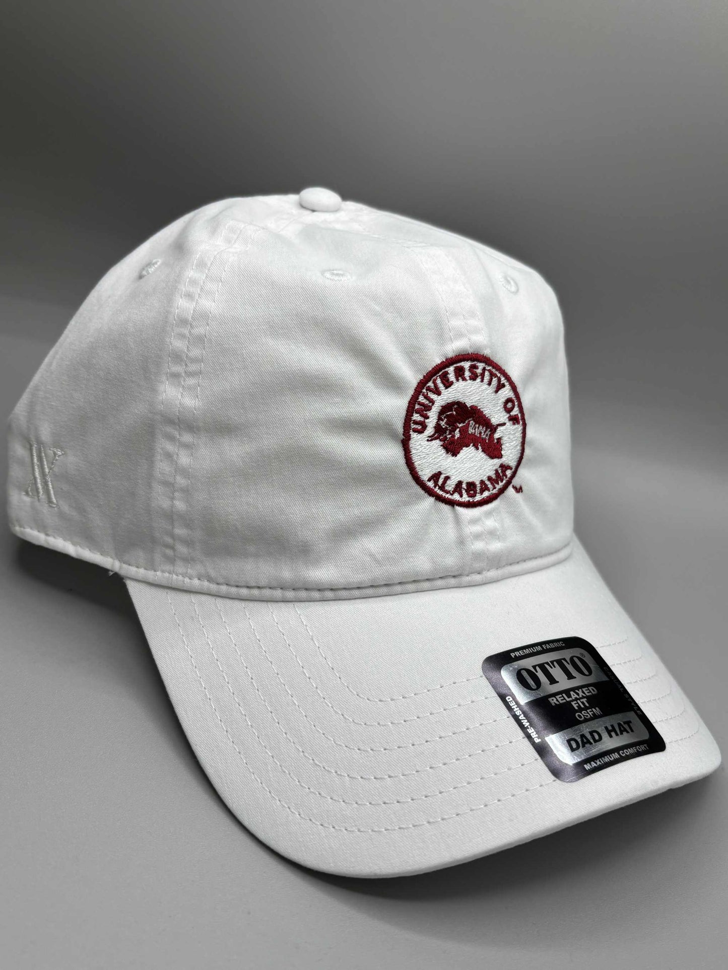 University of Alabama white cotton dad hat with embroidered crimson circle logo and adjustable strapback