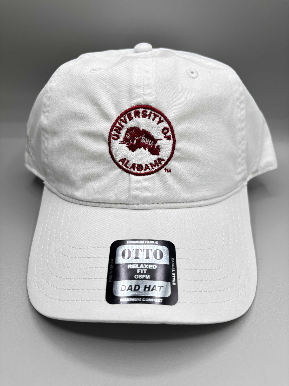 University of Alabama white cotton unstructured dad hat with embroidered crimson circle logo and adjustable strapback