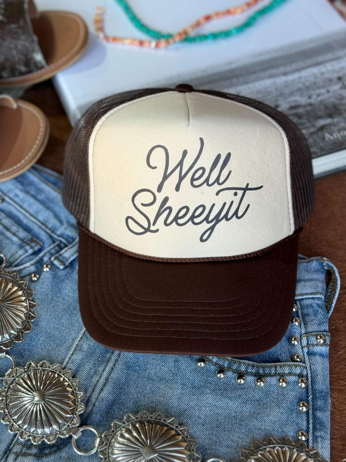 Well Sheeyit Trucker Hat with breathable mesh back and adjustable snap closure
