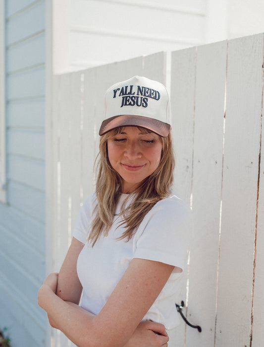 Y'all Need Jesus hat in cream cotton with brown bill and embroidered navy lettering